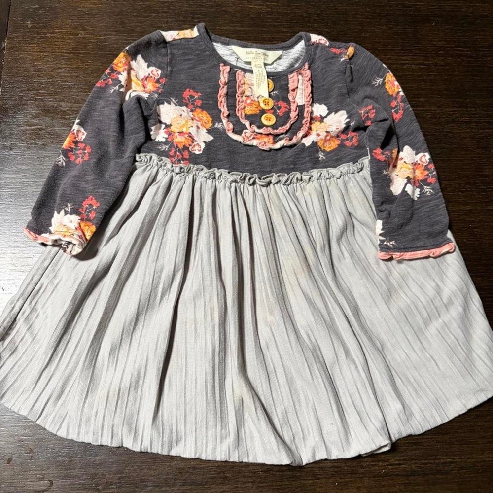 Multicoloured floral babydoll dress with ruffles and buttons. Size: 18-24M